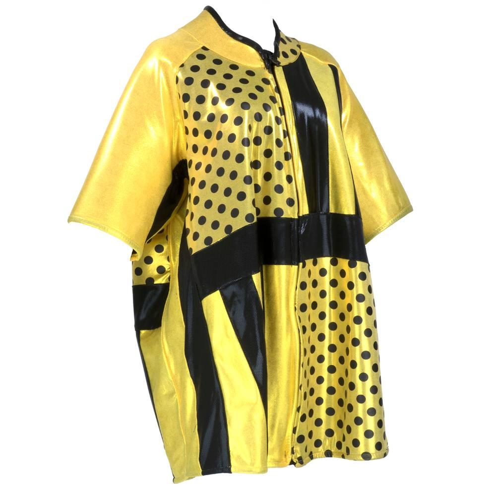 Avant garde coat circa 1990s, Yellow and black neoprene with multi-textures, print and techniques. Oversized zip front. A-line, with mandarin style collar and 3/4 sleeves. Unlined, blue interior. Great conversation starter and guaranteed to get you