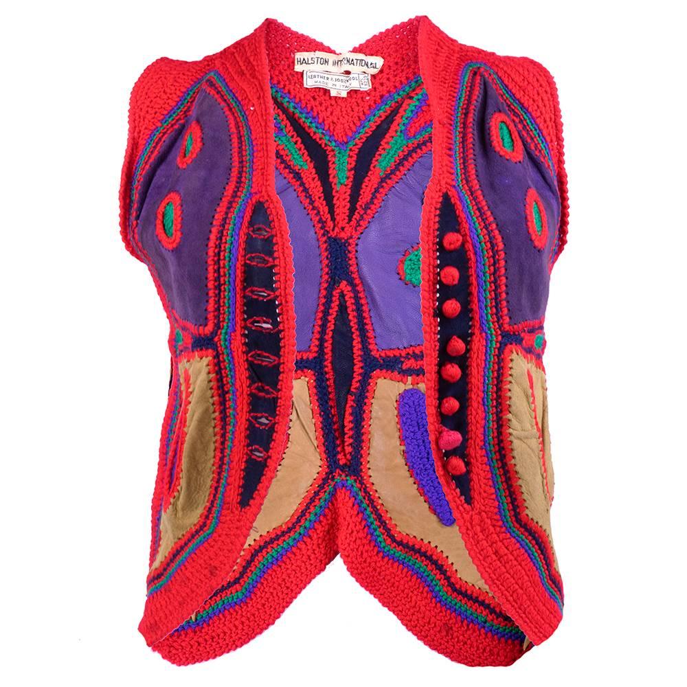 The best example of these types of vests we have ever seen! Red acrylic crochet with multi-color suede inset. By Halston International. Very good condition. Wear commensurate with age. Slight stains - does not detract from overall look.

