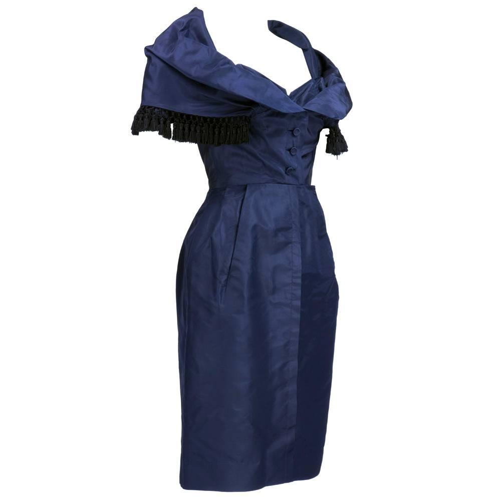 Fabulous late 50s afternoon dress by Christian Dior in midnight blue silk taffeta. Signature portrait collar cut low to reveal separate corselet  - fully boned with front hook and eye closure. Constructed of taffeta and mesh. Collar trimmed in hand
