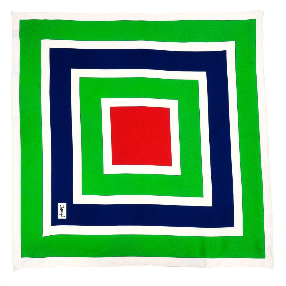 Color blocked silk scarf by the legendary Yves Saint Laurent. Patterned in concentric squares.