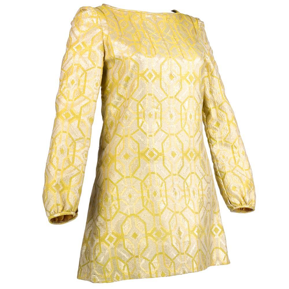 An important relic of the swingin 1960s  from Carnaby St. in London. Gold lame mini dress. Made in Europe expressly for Lord and Taylor. Fully lined tunic style with gathered cuffs. Quintessentially mod.