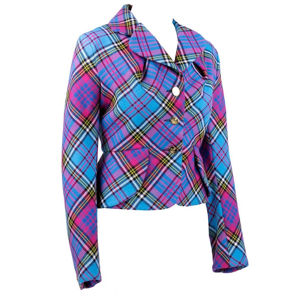 100% wool beautifully tailored jacket by British legend Vivienne Westwood circa 1990s. Great color combo in bright pinks and blues. Gold tone logo buttons. Fully lined.