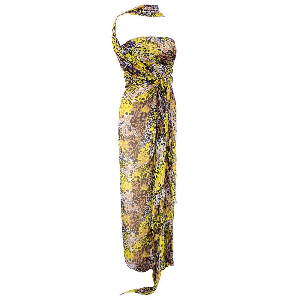 Great 50s style bombshell goddess style gown in chiffon with abstract animal print. Beautifully draped with wraparound halter and attached sash belt. Boned bodice, fully lined and zip up the back. Simply stunning and amazing entrance maker.