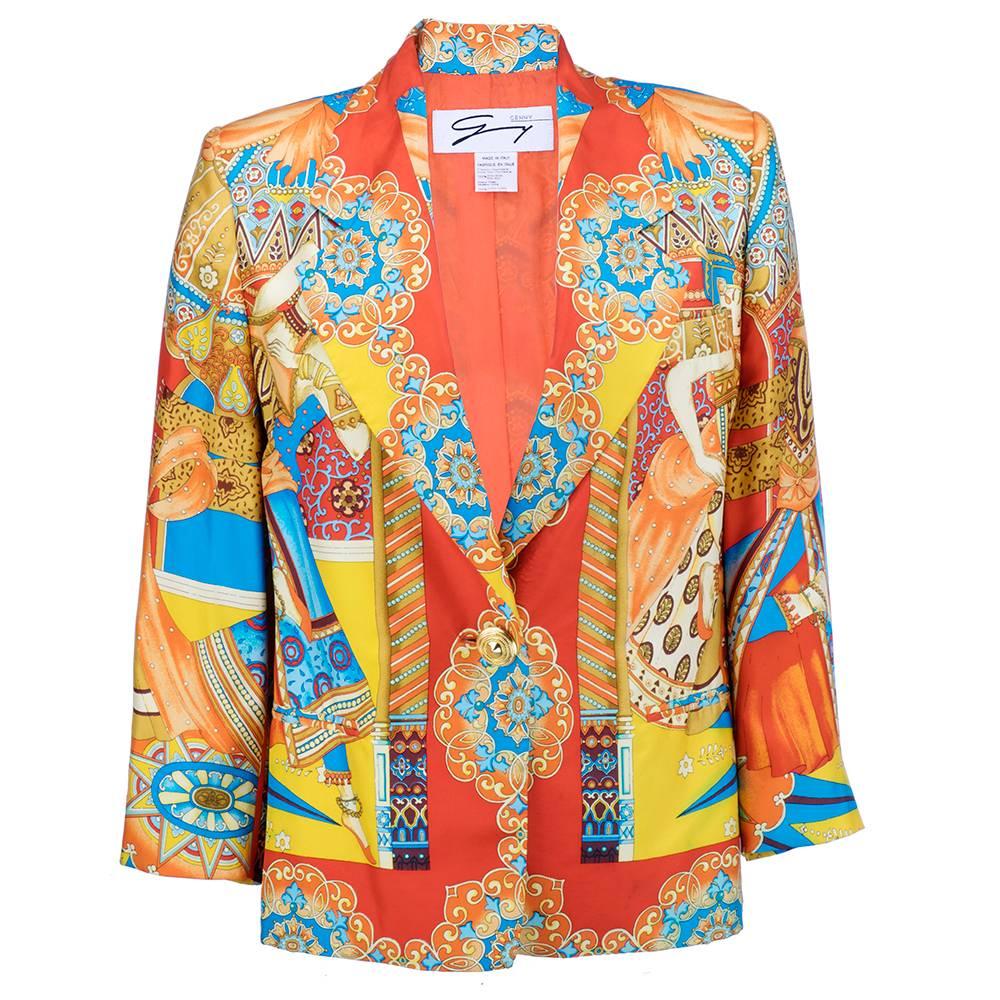 Bold and beautiful lightweight blazer of 100% silk. Fully lined with opulent print in oranges and blues. The final word in statement pieces. Single gold tone button closure. Padded shoulders.