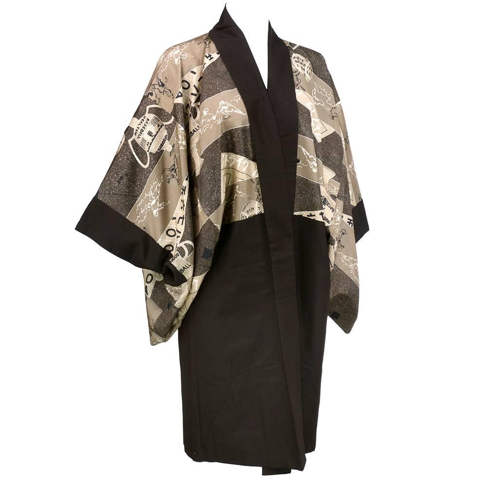 Rare and unusual kimono of brown and tan with panels of baseball themed print. Shorter with attached sleeves. Silky twill. 