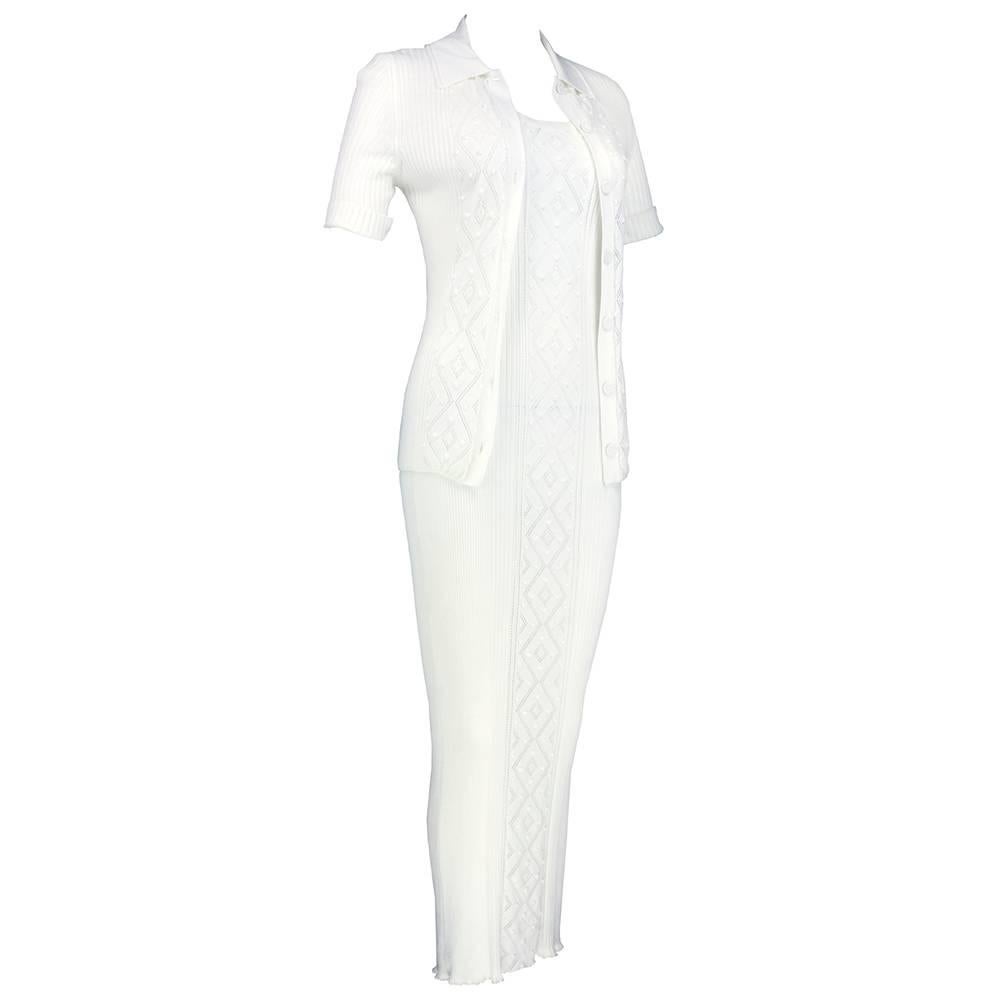 Sweet and sexy lightweight ensemble perfect for summer by Jean Paul Gaultier. 100% cotton tank style maxi dress cut to hug curves. Ribbed with peekaboo panels. Comes with matching short sleeve cardigan. Sizing very flexible due to stretch in