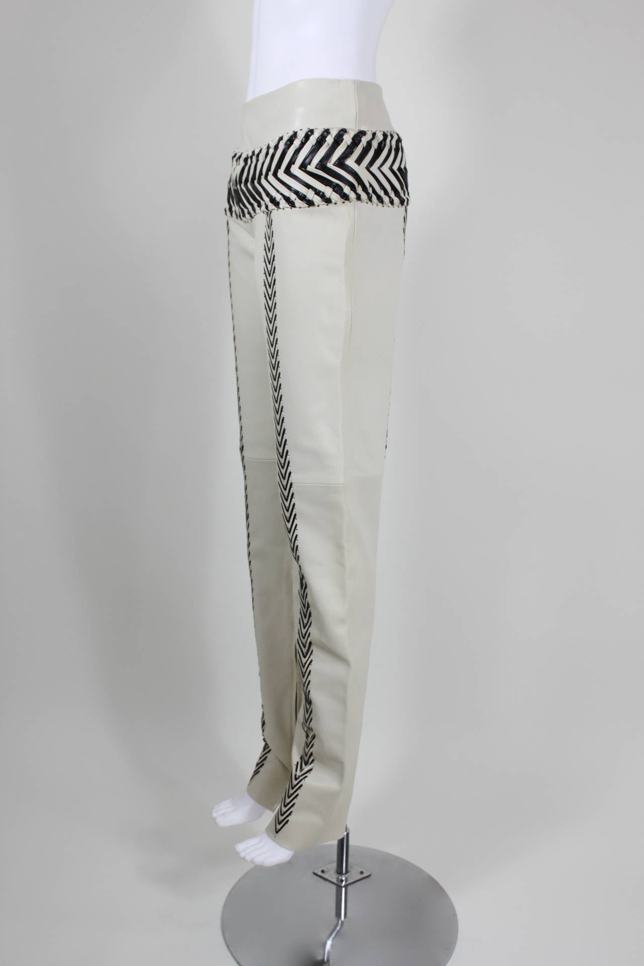 Gianfranco Ferre Cream and Black Leather Braided Trousers

-Unlined
-Zips in back
-Marked an IT size 40

Measurements--
Waist: 27 inches
Hip: 36 inches
Length, Waist to Hem: 44.5 inches
Inseam: 35 inches
Rise: 10 inches
