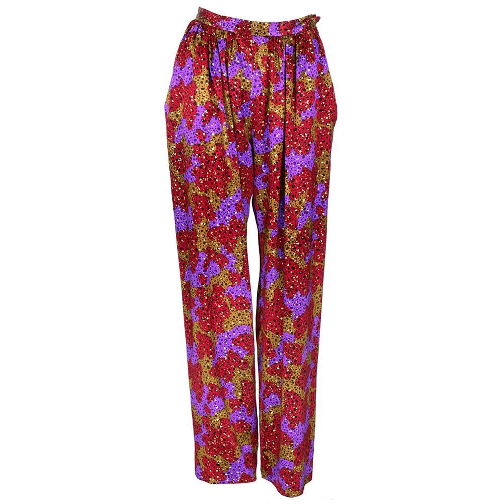 The coolest pants ever!!! Red, purple and brown with black and gold splatter print on 100% silk wide legged pants. High waisted with draped pockets. Side zip closure.