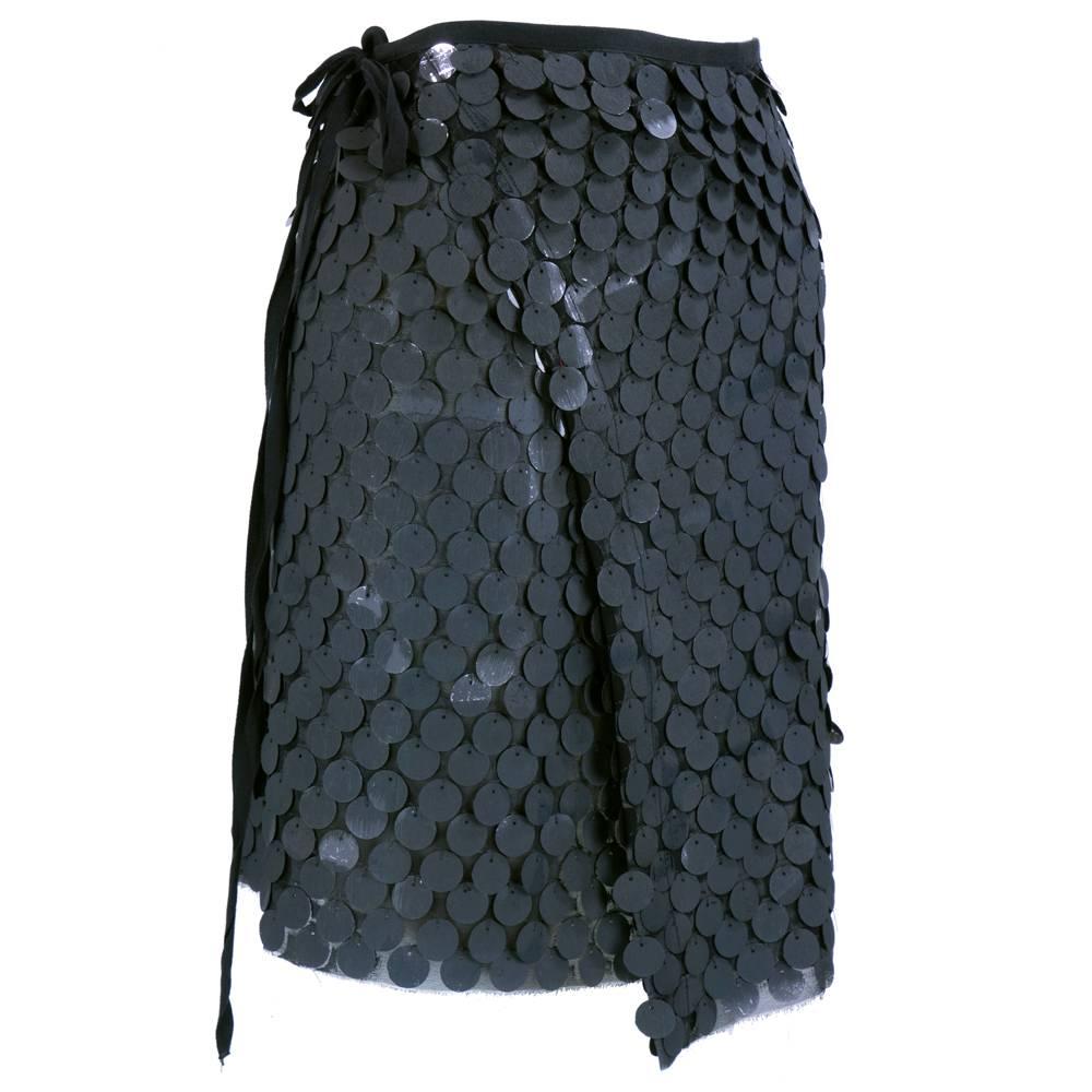 A true piece of art by Ann Demeulemeester. Sheer black asymmetrical wrap skirt with hand stitched paillettes. Completely painted with wide brushed stroked grey paint.  Very dramatic effect. Sizing somewhat flexible due to wrap style.
Would best fit