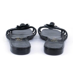 Chanel leather slides with Signature Camellia Adornment