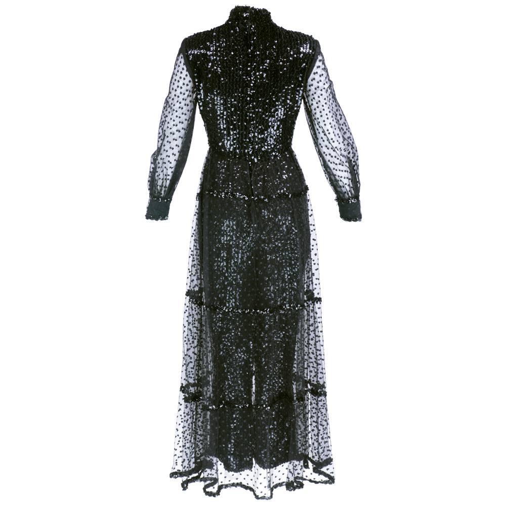 Out of this world  piece! Circa 1960s evening jumpsuit fully covered with sparkly sequins.  Tulle over-skirt dotted with embroidered polka dots. Matching sheer full length sleeves. Zips up back.  From the swinging 60s!