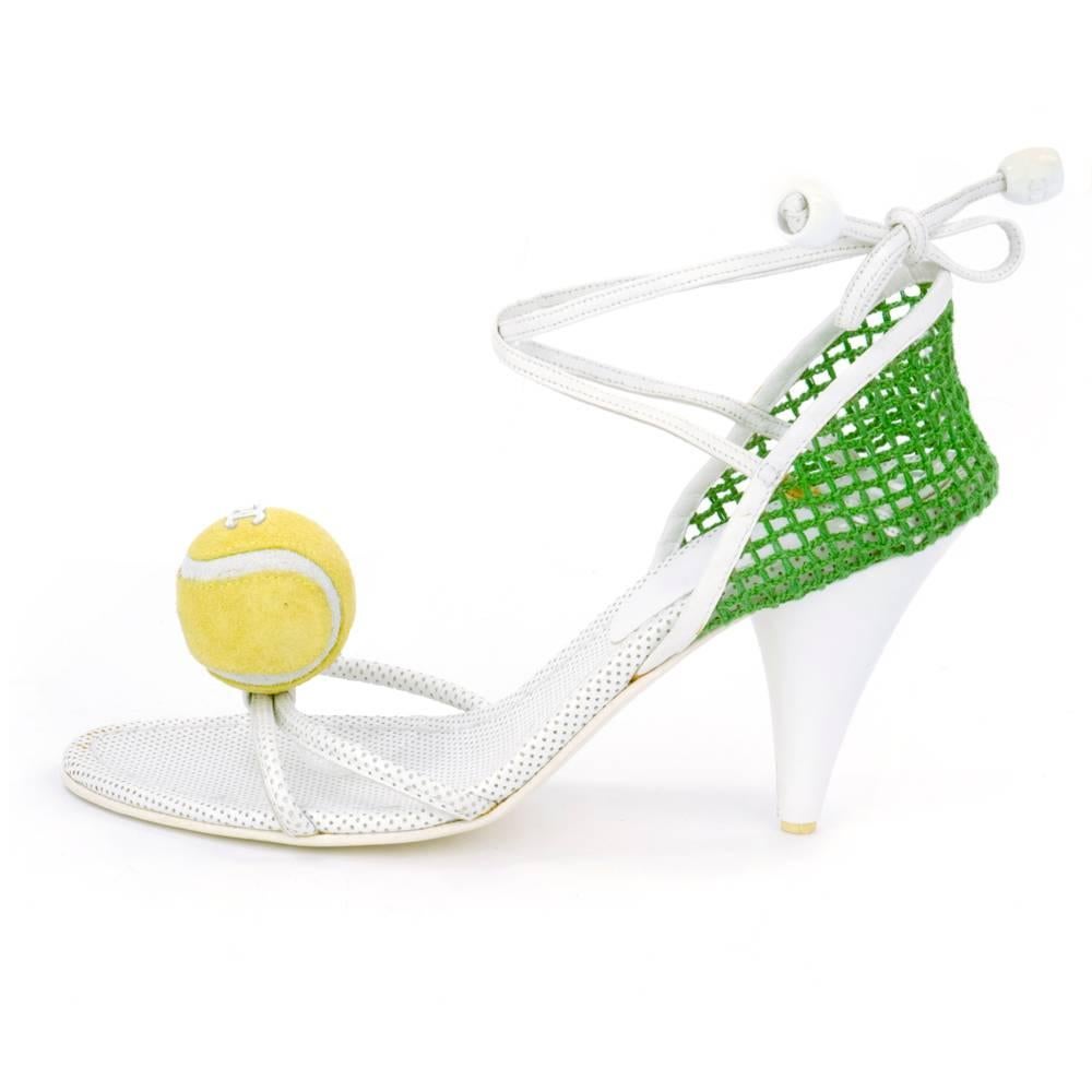 Quirky and highly collectable high heel sandals by Chanel circa early 2000s.  Green mesh back with wrap around ankle ties and miniature tennis ball embellishment. Wimbledon ready.  