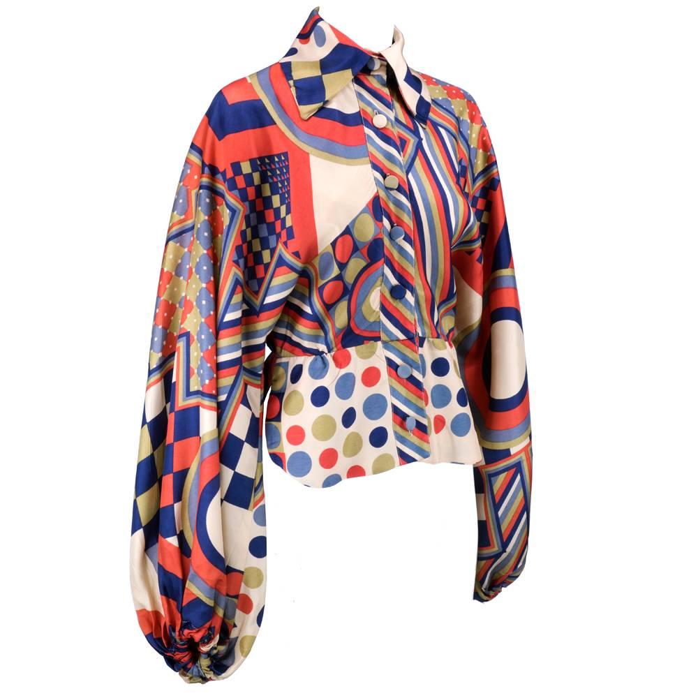 The most way out blouse ever. Jean Varon circa 1970s. Rayon blend, silky in multi-color wild print with balloon sleeves, high and wide collar and nipped waist. Out of this world does not even begin to describe how cool this piece is. rarely seen