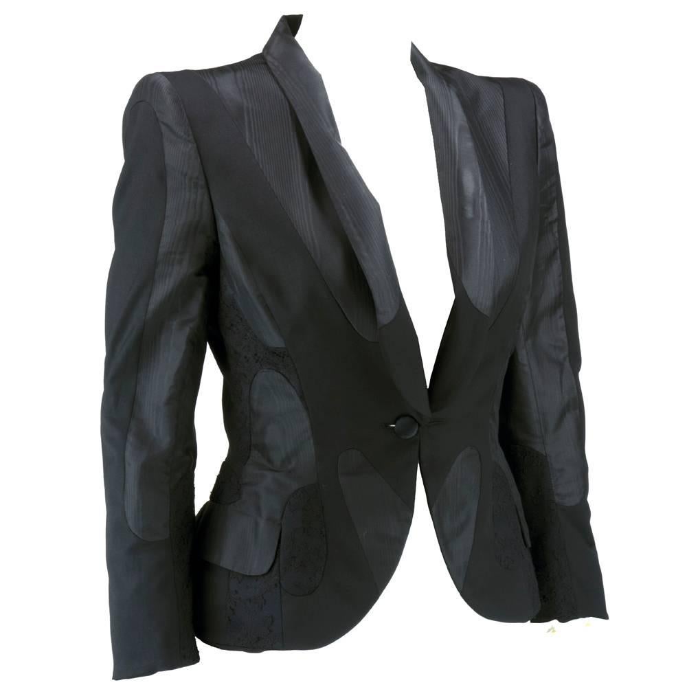 Beautifully constructed ultra modern with stylized patchwork of varying fabrics from moire to lace. Super fitted - silk, wool, poly blend. With hidden patch pockets. Sharp, padded shoulder with single button closure.  Padded hips as well.