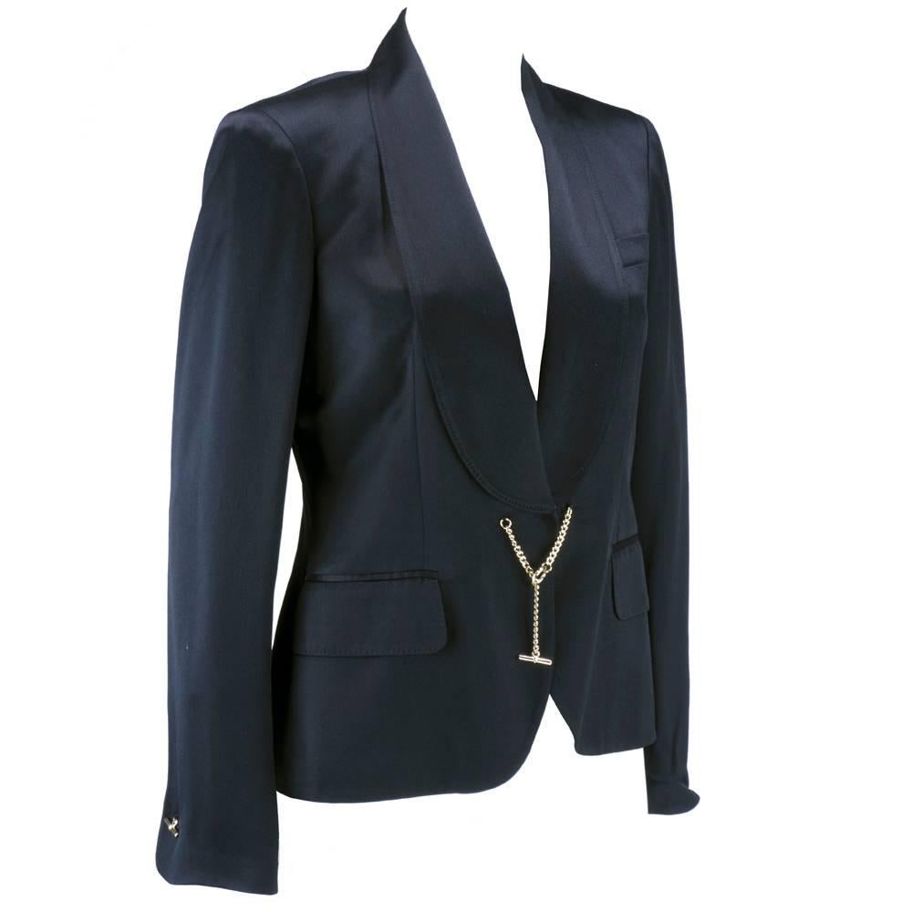 Alexander McQueen ultra modern tuxedo jacket moment. Shawl collar 100% silk - slim fit. Fully lined. Chrome link and toggle closure and cuff links along with hidden button with snap at waist. Double patch pockets and lightly padded shoulders. The