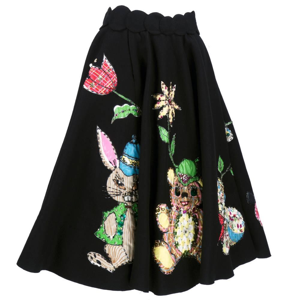 Kitschy cute black felt skirt - full circle. Colorful polished cotton patches of whimsically dressed stuffed animals with colorful beading, rhinestones and sequins. Circles pieced together for waist band.  THE cutest thing we have ever seen.

Full