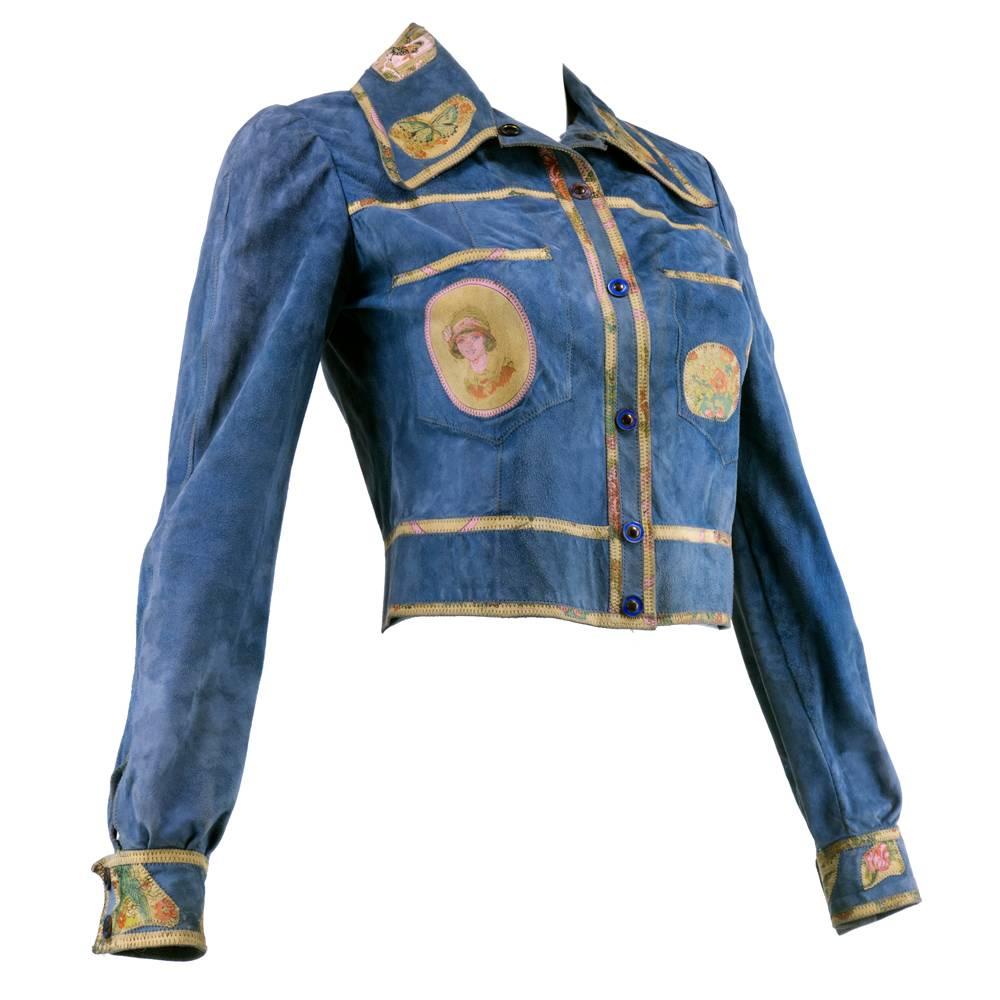 Early and rare Cavalli piece. Short, but not cropped, jacket stops at natural waist. Patchwork appliqués at front pockets, collar, and cuffs. Snap button closure. Buttons at cuffs.