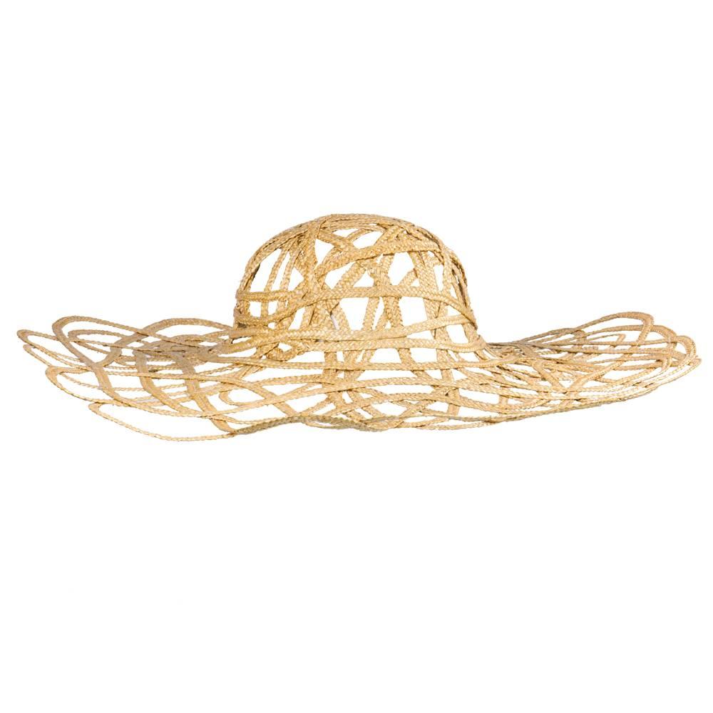 Whimsical piece by Comme des Garcons. Natural straw woven and wrapped to form an openwork lattice. Wide brim and unlined.  Fancy and fun!