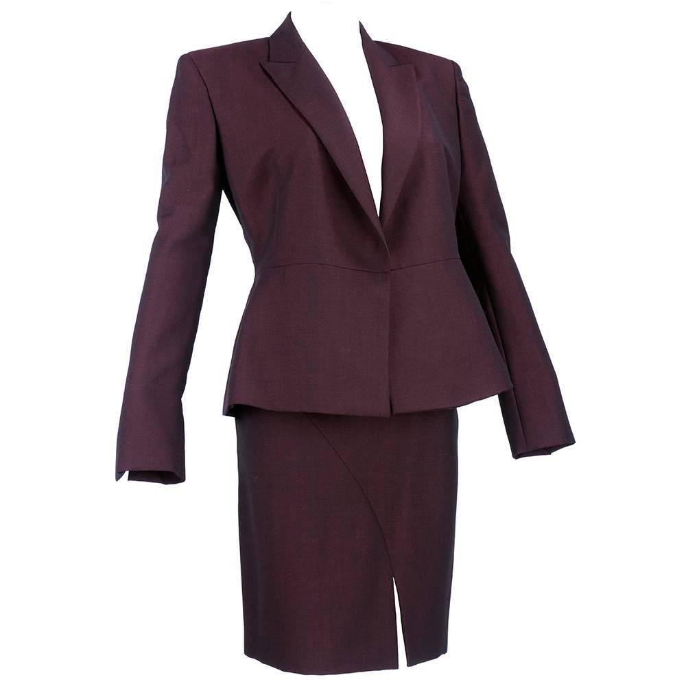 Tom Ford era power suit for Gucci. Deep blackened burgundy in wool and cashmere. Fully lined. Sharp lines and signature crisp tailoring. The tailoring is everything. Timeless. New with tags.

Skirt:
Waist: 24 inches
Length: 20 inches