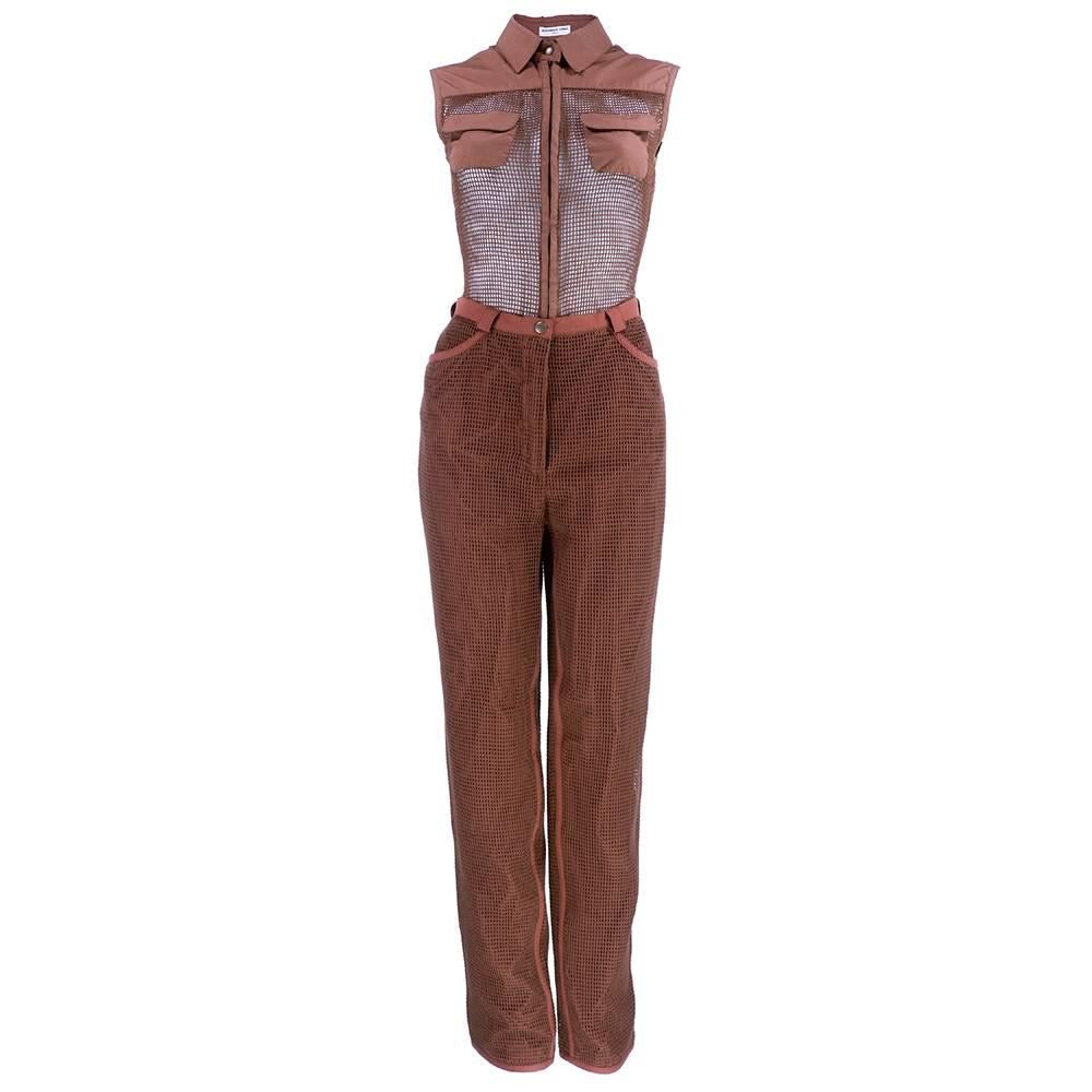 Rare vintage piece from Belgian designer Veronique Leroy. Two piece ensemble in mocha. Bodysuit in mesh with strategically placed coverage. Zip front with thong back. Pants in coordinating lined  cotton blend mesh.

Pants-
Waist: 27 inches
Inseam: