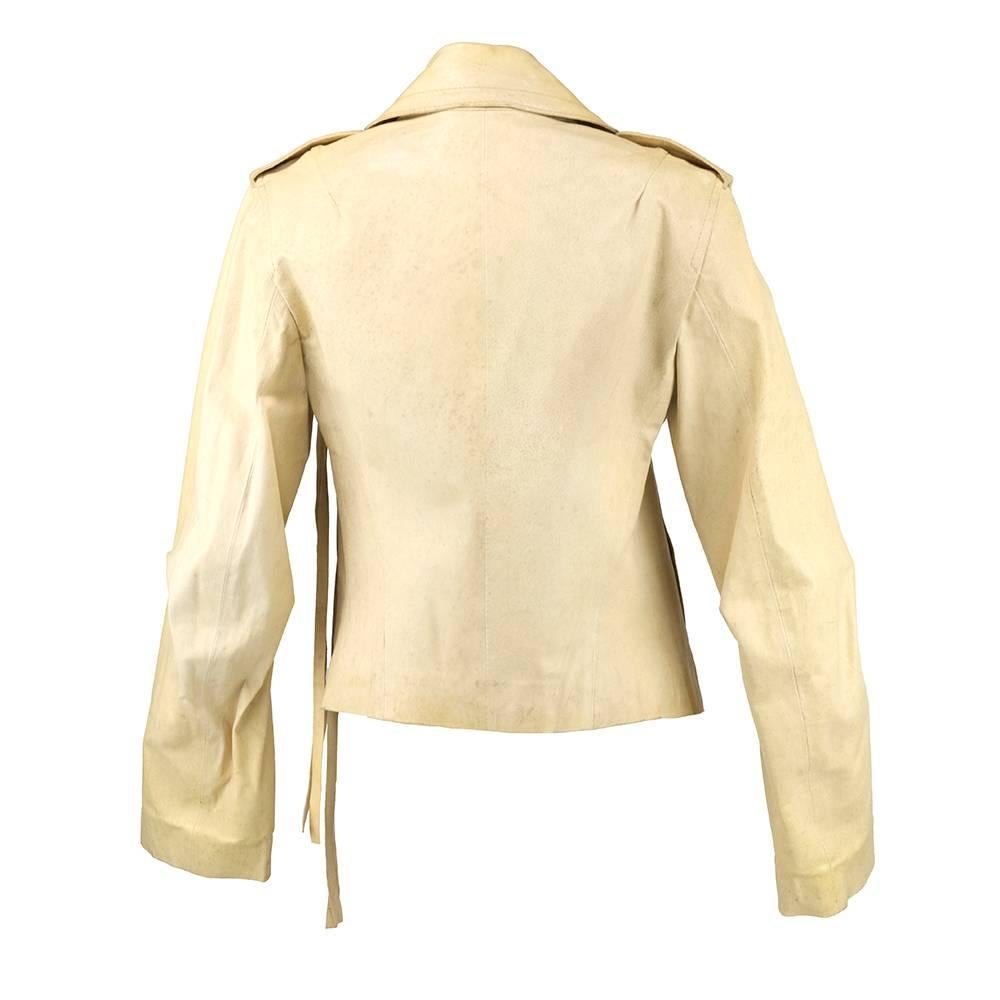 From highly respected Belgian designer Ann Demeulemeester - Ivory leather jacket in distressed looking ivory. Ties with extra long fringe. Slash pockets with buttons.