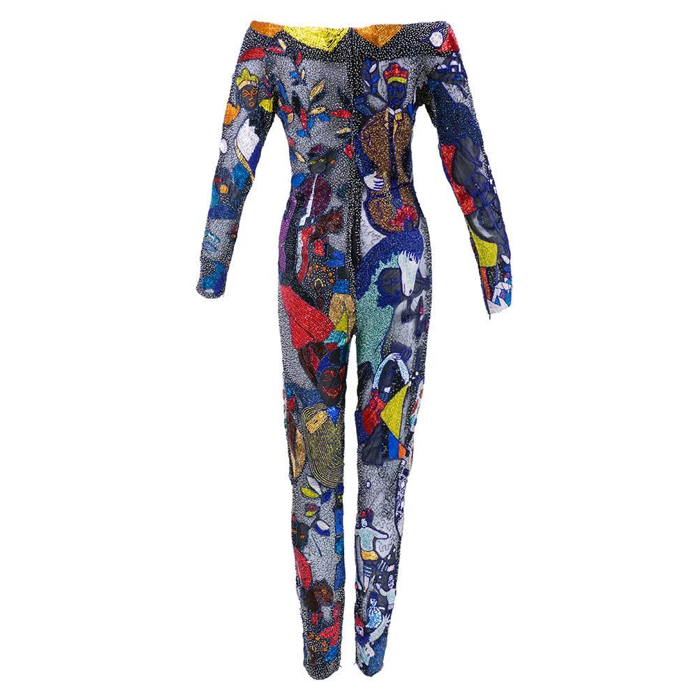 Another piece of fashion history - a Versace fully beaded catsuit with images culled from Chagall artwork.  As seen in famous images  the runway show on Naomi Campbell. Atelier. Multi-colored hand beaded jumpsuit. Incredible work of art! Full length