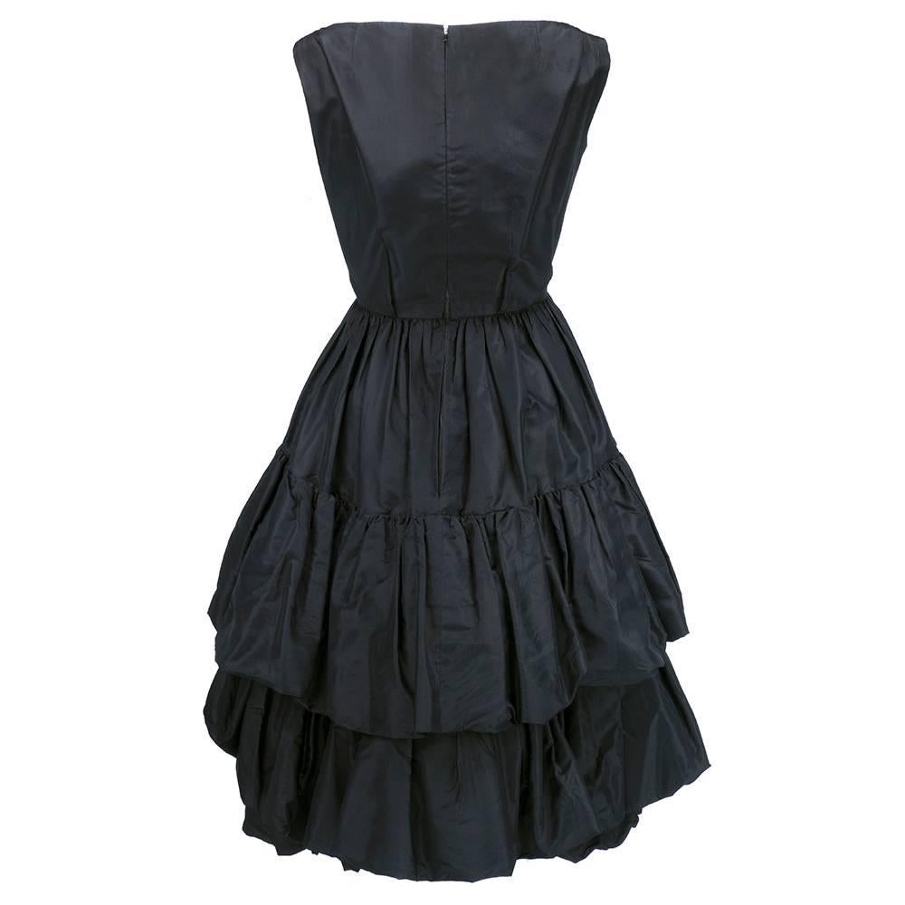 Incredibly rare and important piece by Yves Saint Laurent for the house of Dior executed during his short tenure there. Dated Fall/Winter 1959 with couture number partially obscured. Fully intact with all proper underpinnings. Remarkable piece of
