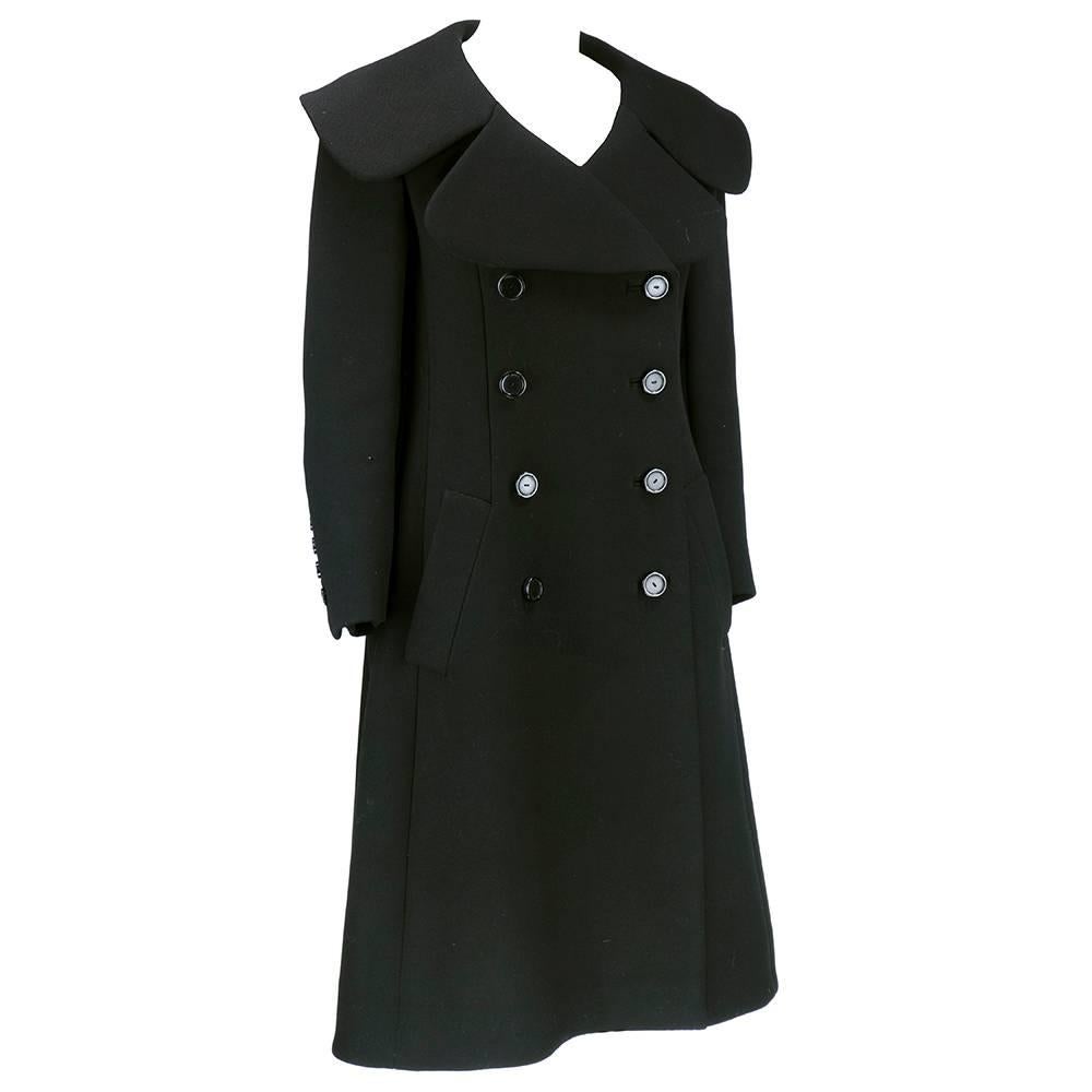 Incredibly tailored and beautifully constructed heavyweight overcoat by great America designer Norman Norell circa late 19760s. Fully lined with oversized collar and double breasted styling and slash pockets. 