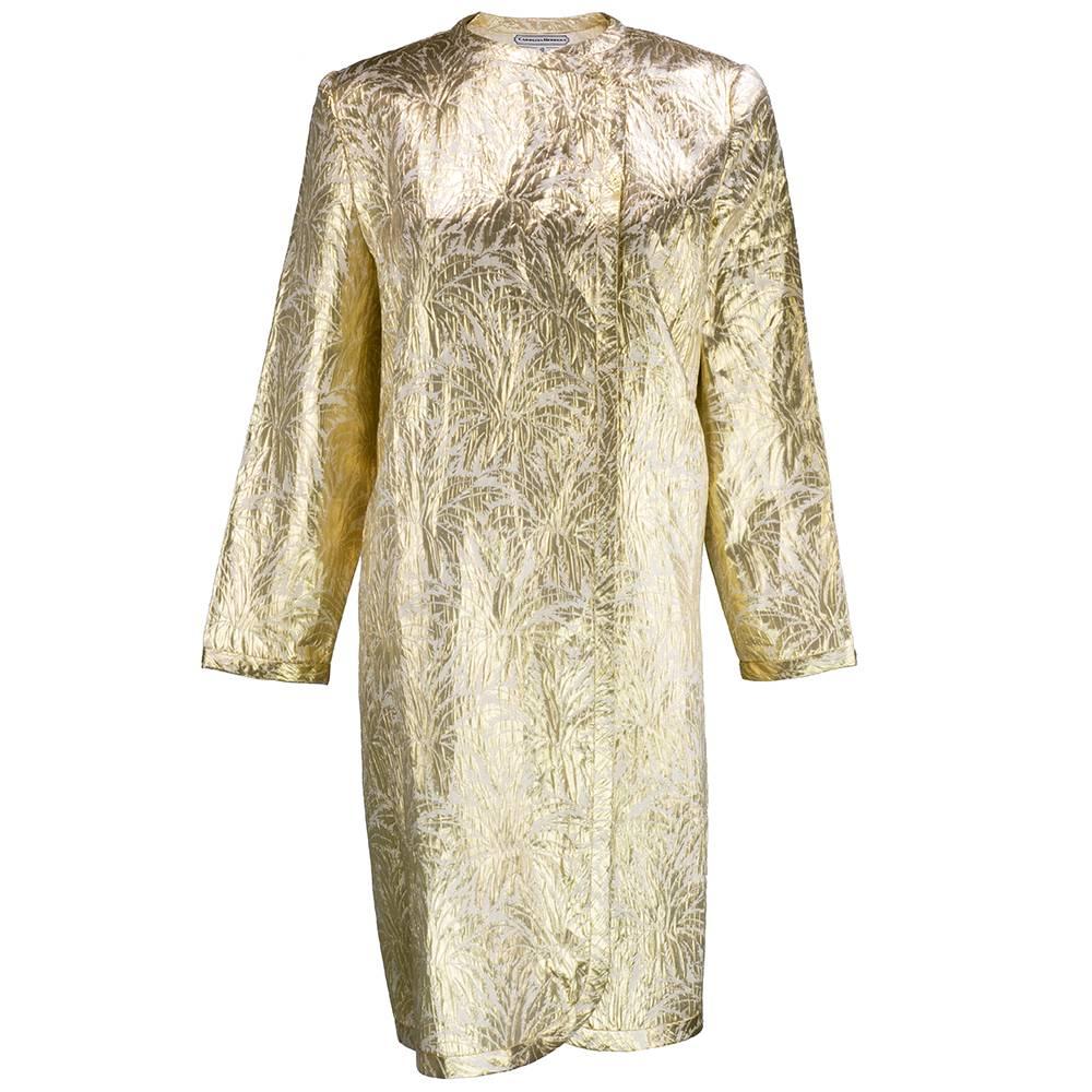 Silk lurex blend, lightweight evening coat by Carolina Herrera circa 1980s. Palm leaf motif on loose, tunic style and unlined,  Perfect cover up for any formal or semi formal event. Easy breezy to wear. Snap closure at neck.