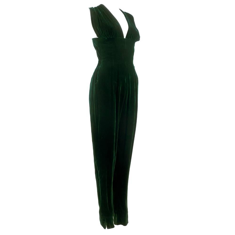Drop dead gorgeous jumpsuit in rich emerald green velvet with matching swing jacket. By spectacular Italian couturier Giovannelli Sciarra. Catsuit style - super sexy with plunging neckline and tapered legs. Small slash pocket at hip. Even more