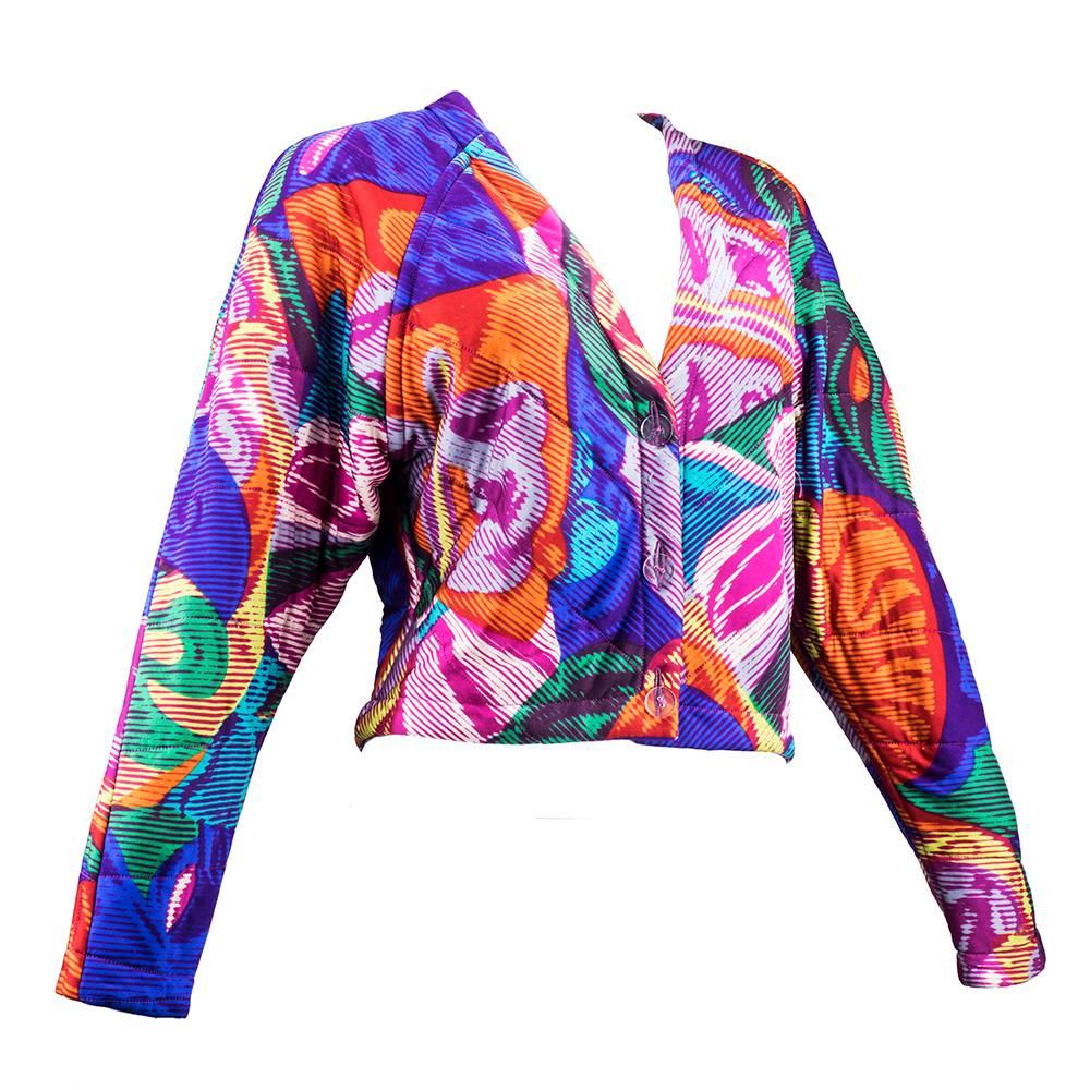 Op art abstract print Missoni quilted jacket circa 1980s. Signature silk jersey in multi colors. Boxy cut and cropped with clear lucite buttons. Fun time piece.