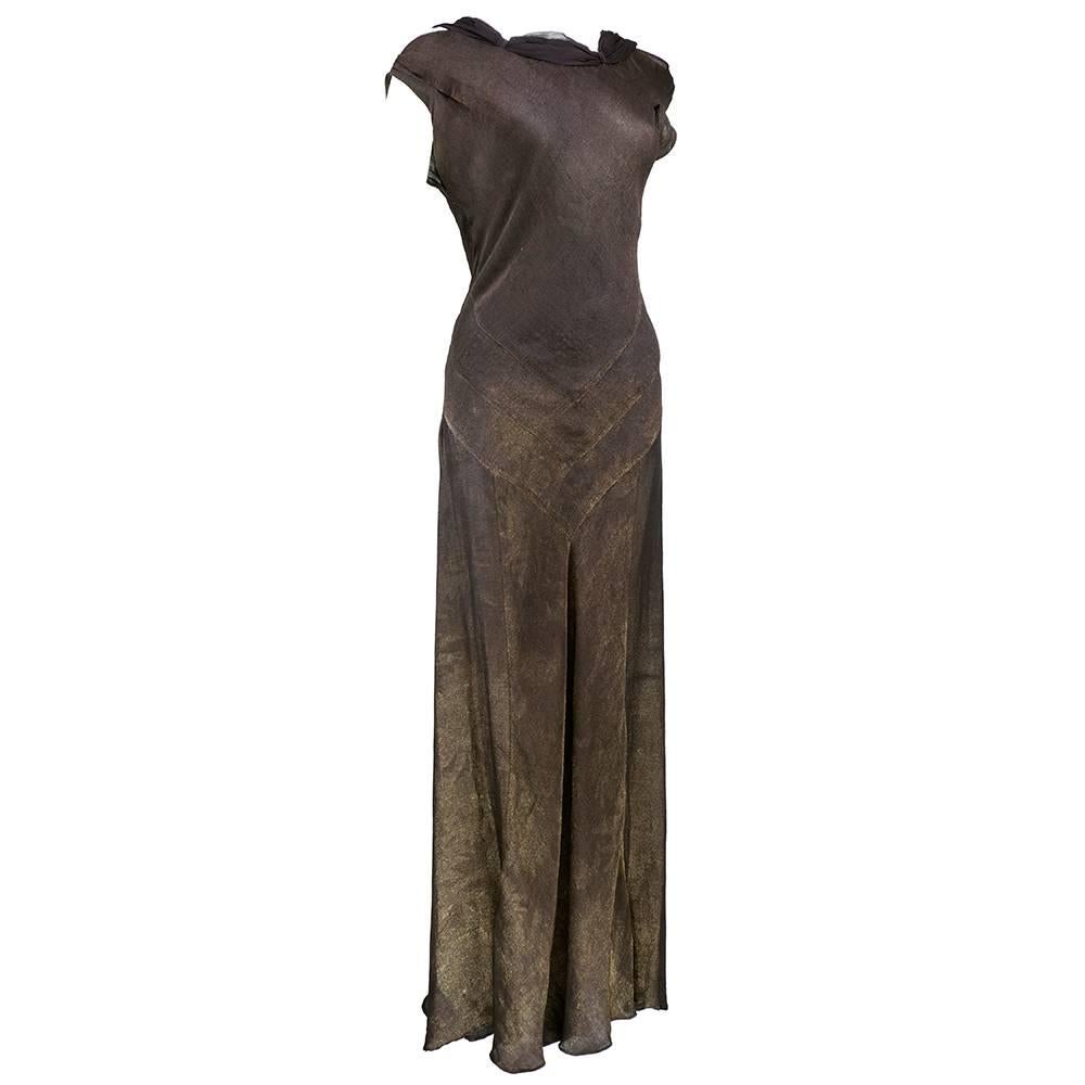 A super stunner 1930s Deco age gown in rich brown shot with gold thread. Has beautiful burnished effect and very interesting pattern. Cowled neckline and low cut back. Lovely attached rolled collar. Sizing slightly flexible due to bias cut.