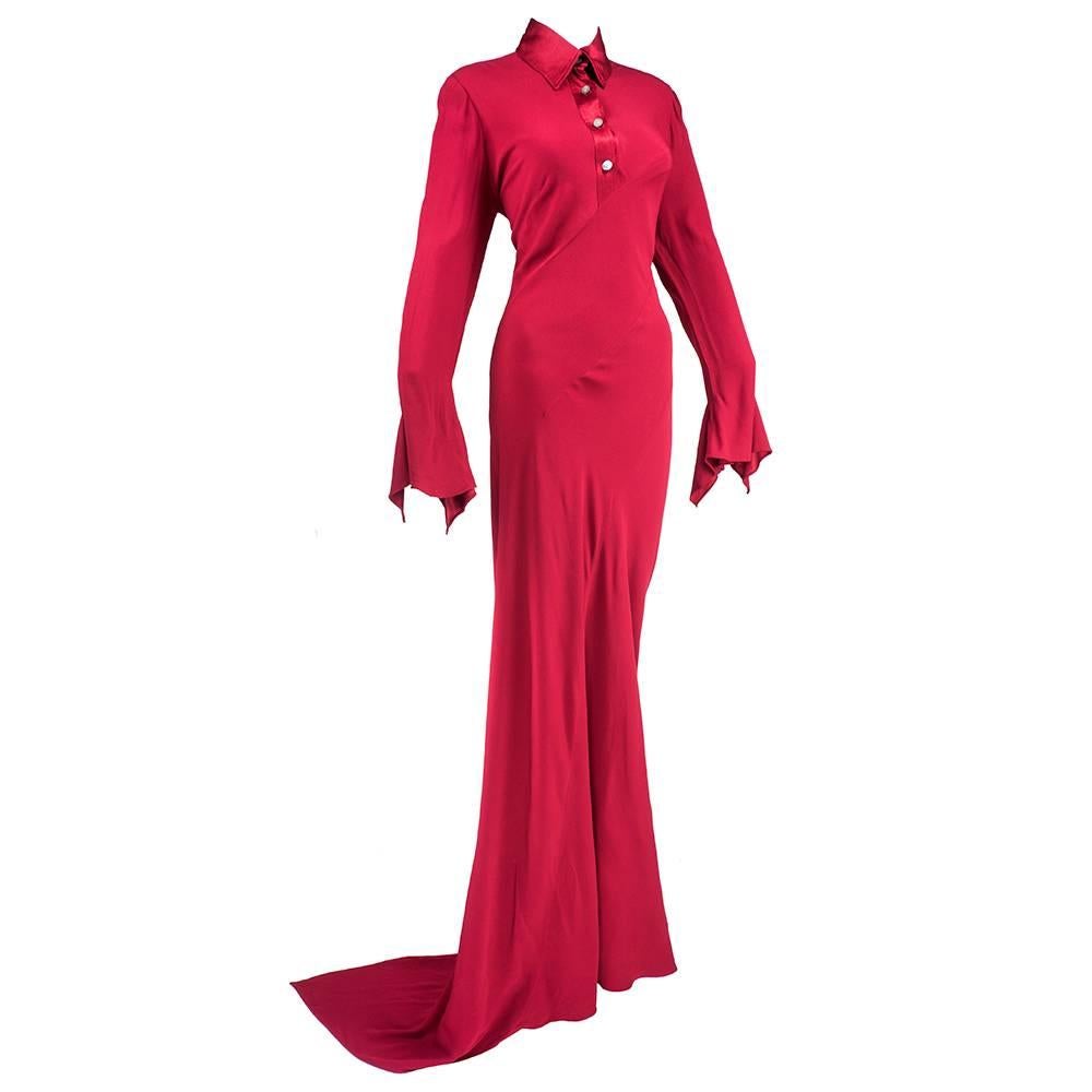 Early work by British duo Pearce-Fionda. Red satin backed rayon crepe in beautiful exquisite bias cut that creates a lovely drape and a pointed train. Extra long sleeves with fluted cuffs.   Mother of Pearl buttons at neck. Simple elegance and
