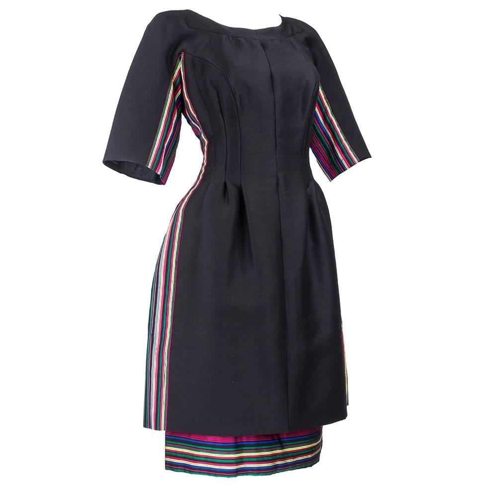 From retailing legend Sara Fredericks a wonderfully designed day dress circa 1960s. Intricate pattern with rainbow striped accent fabric. Sara Fredericks employed dynamic young designers of the day such as Richard tam and Sarmi. The specific