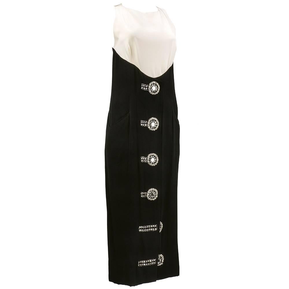 Karl Lagerfeld era Chloe label cocktail/evening dress in black and white rayon blend. Oversized faux diamante buttons down front. Empire waisted with racer neck back and pockets at hips.  Zips up back, slit at front hem. Tea length - mid calf length
