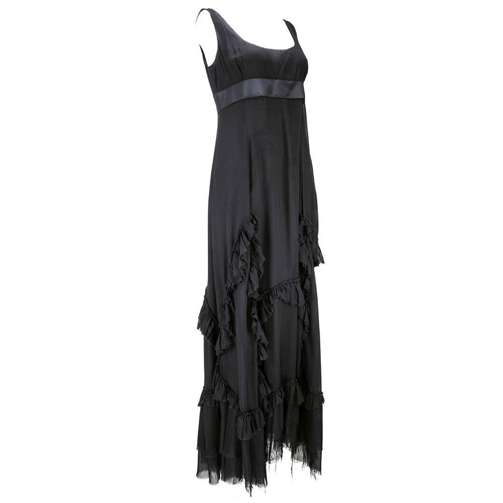 Shades of Jane Austen come to mind with this simple yet seductive gown by Prada. Black 100% silk chiffon with empire waist, flounced skirt with uneven and unfinished hem. Satin  band under bust. Super romantic.
