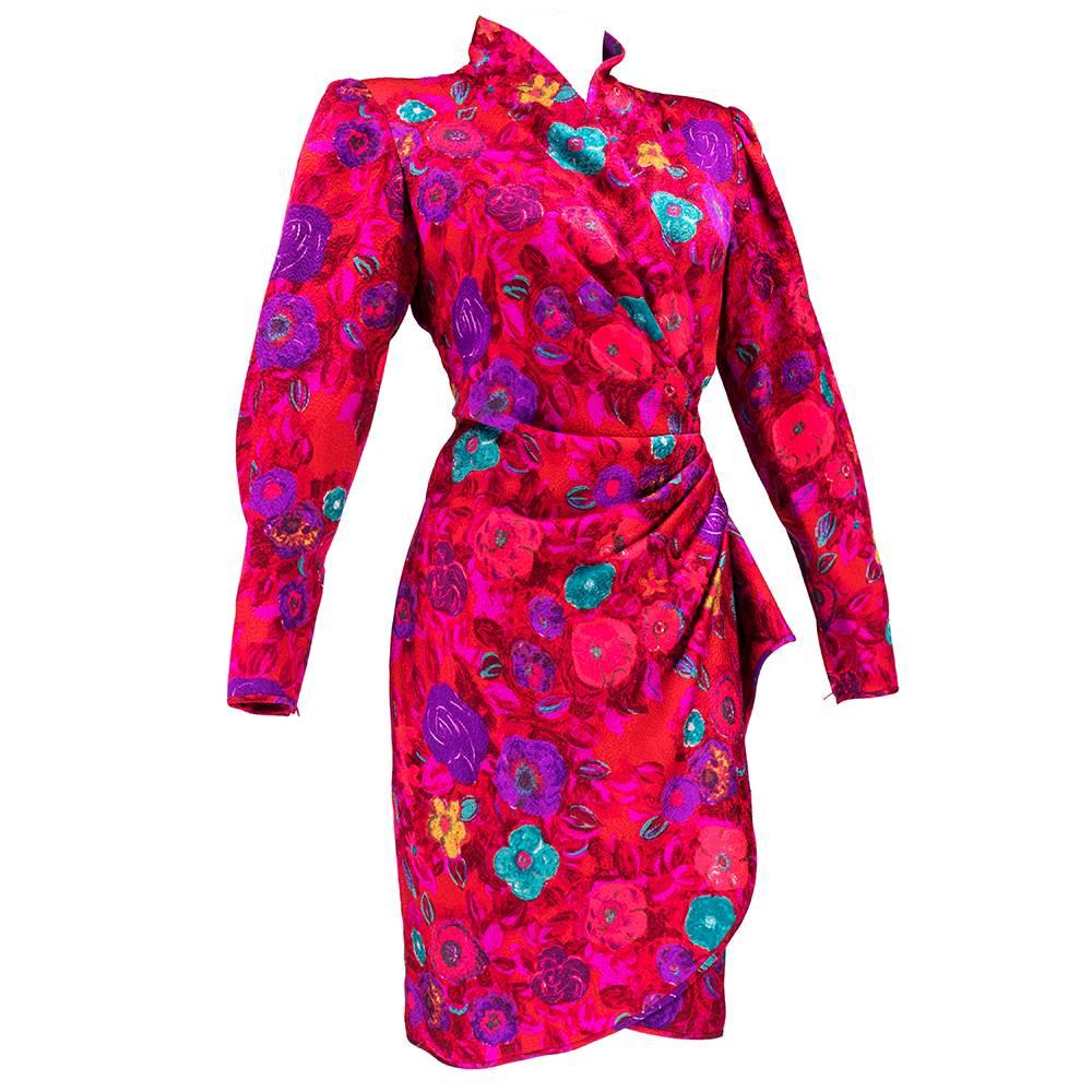 Classic Ungaro from the 1980s.  Red and fuschia  poly blend jacquard with a  teal, purple and chartreuse abstract floral. Wrap style with shirring at waist with 3 button closure and sarong style skirt. Fold over collar, padded shoulders and zip up