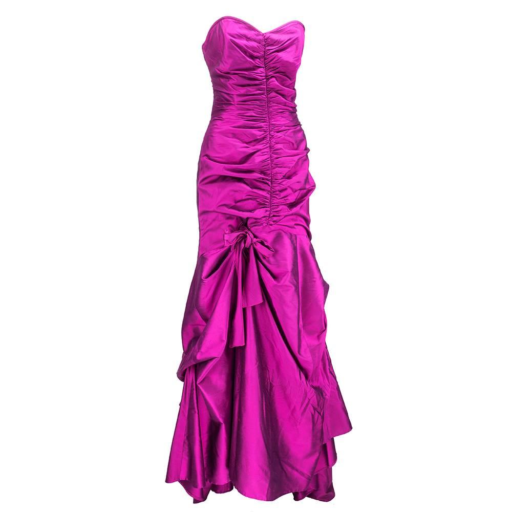 Valentino fushia strapless silk iridescent taffeta gown circa early 2000s. Body con ruching with gathers down the front middle of torso, bustle back with train, gathers to bow on right side front. Full, sweeping skirt. Boned bodice. Fully