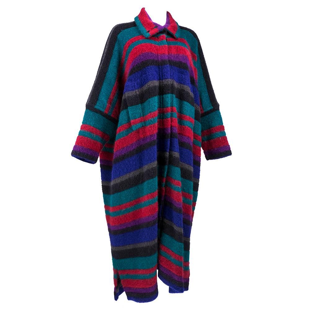 The most cozy cardigan coat you will ever own.  Super-sized full length cardigan from the legendary Italian fashion house of Missoni.  Deep rich tones make up the striped palette. Buttons down front. Wears like a warm, fuzzy coat with pockets at hip.