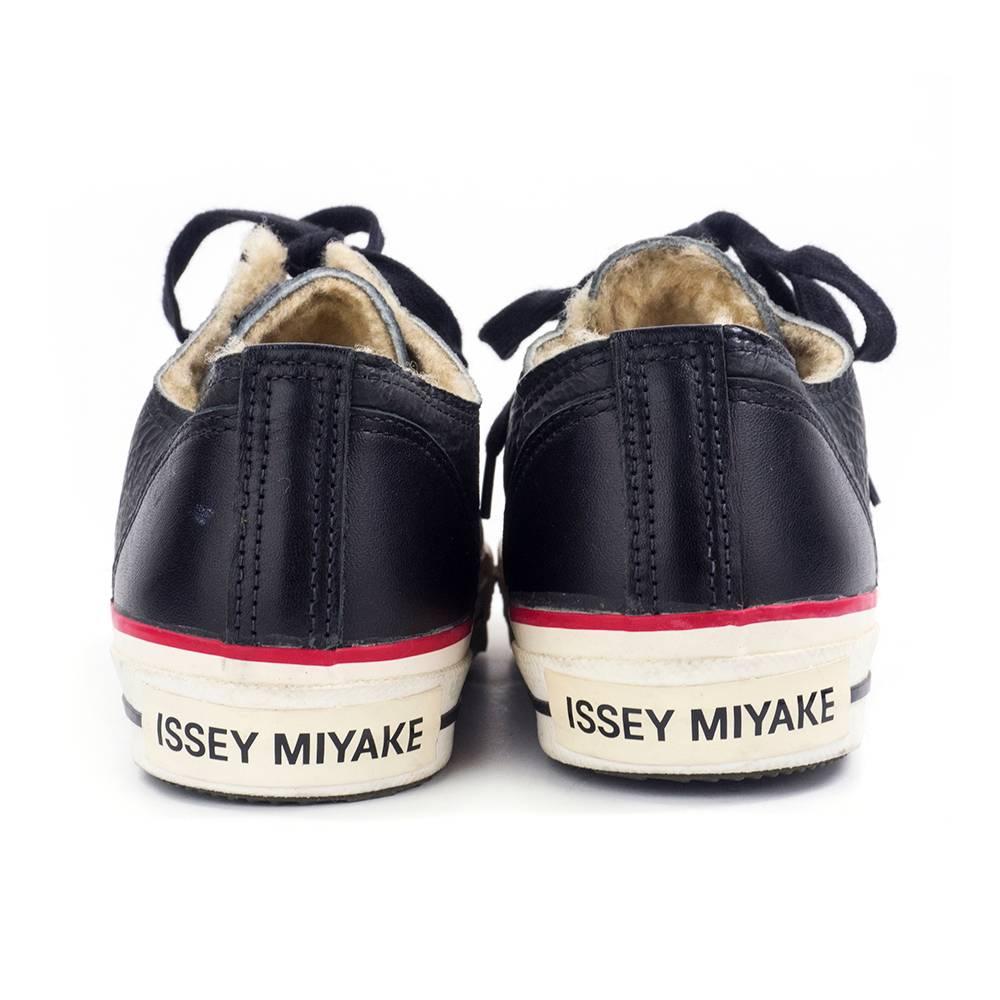 Too cool Issey Miyake sneakers in classic low top Converse style. Black leather with fleece lining. Approximately a US women's size 7. Never worn.