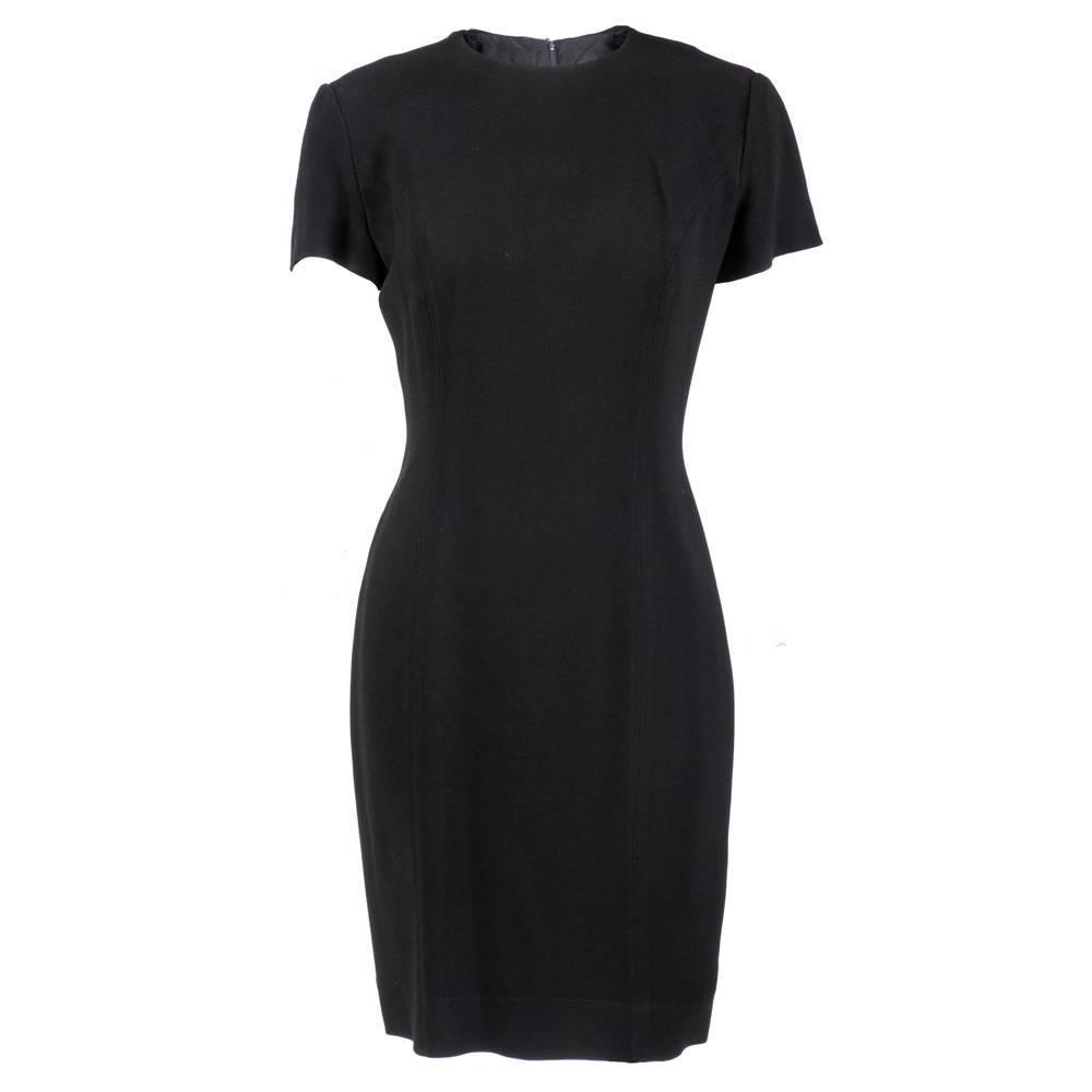 A fabulous black rayon dress from Moschino Couture done with embroidered eye embellishment on the back. Short sleeve sheath dress. Back zipper closure. Fully lined.
 