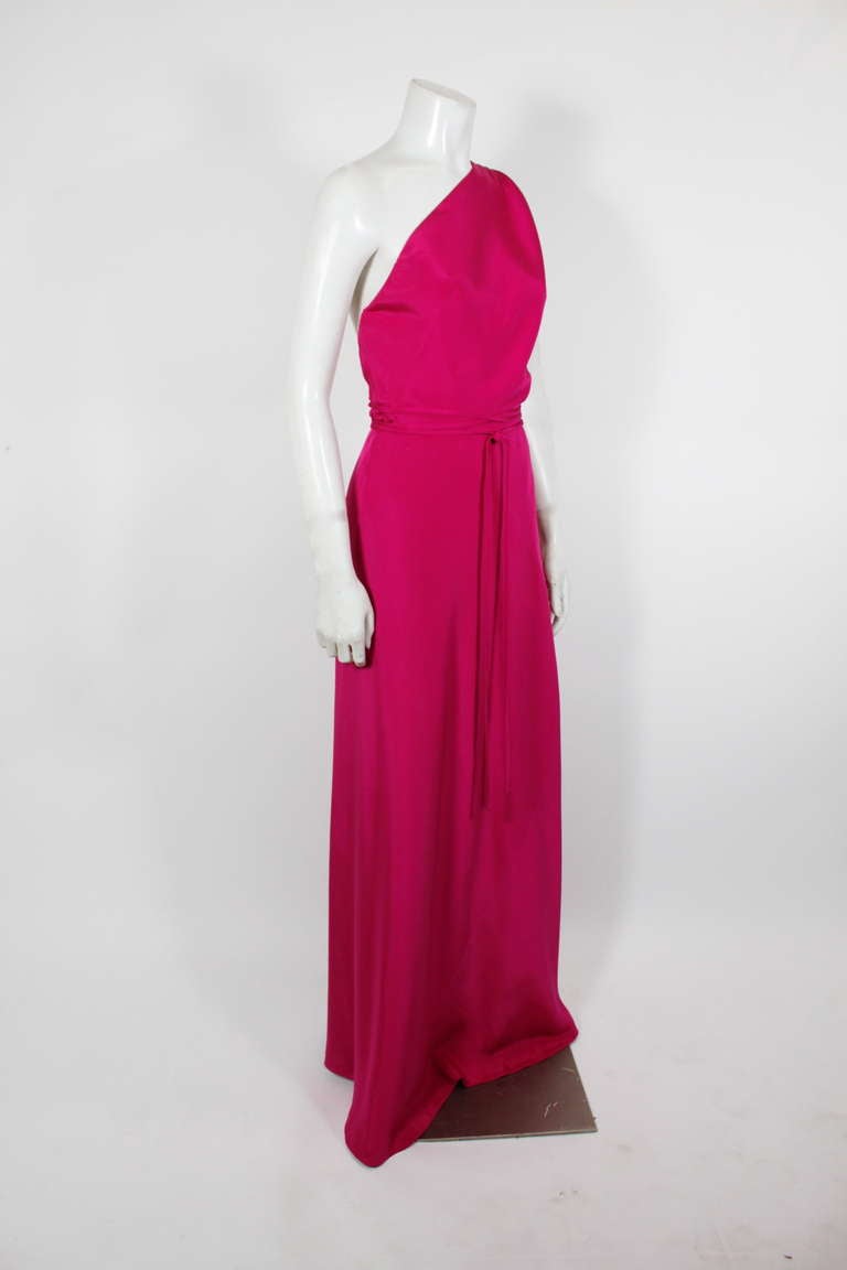 A stunning electric fuchsia avant garde gown, the silhouette a nod to early 40s iconic Grecian gowns from Madame Grès. The gown has an asymmetrical wrap that is a remarkable piece all on its own.

Measurements--
Bust: up to 36 inches
Waist: up