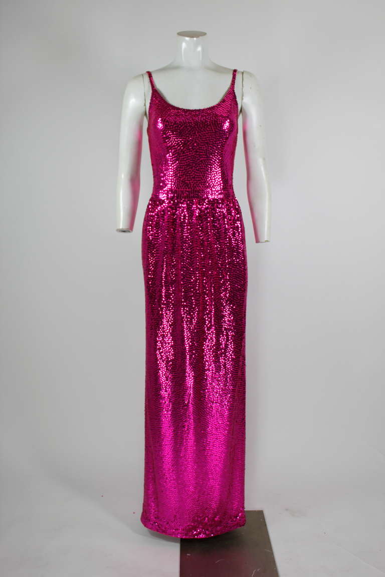 An absolutely stunning fuschia sequined gown attributed to American designer Norman Norell. The iconic 