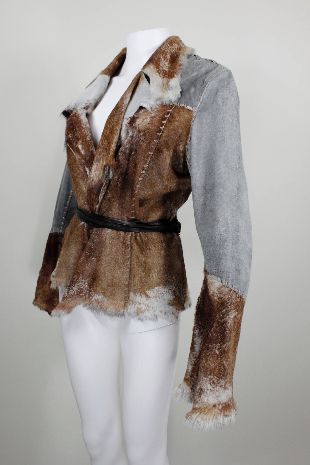 An ultra luxe, leightweight jacket from Sylvie Schimmel featuring panels of brown speckled fur and slate grey textured leather. The panels are connected with embroidered stitching. 

-Unlined
-Double bound leather cord