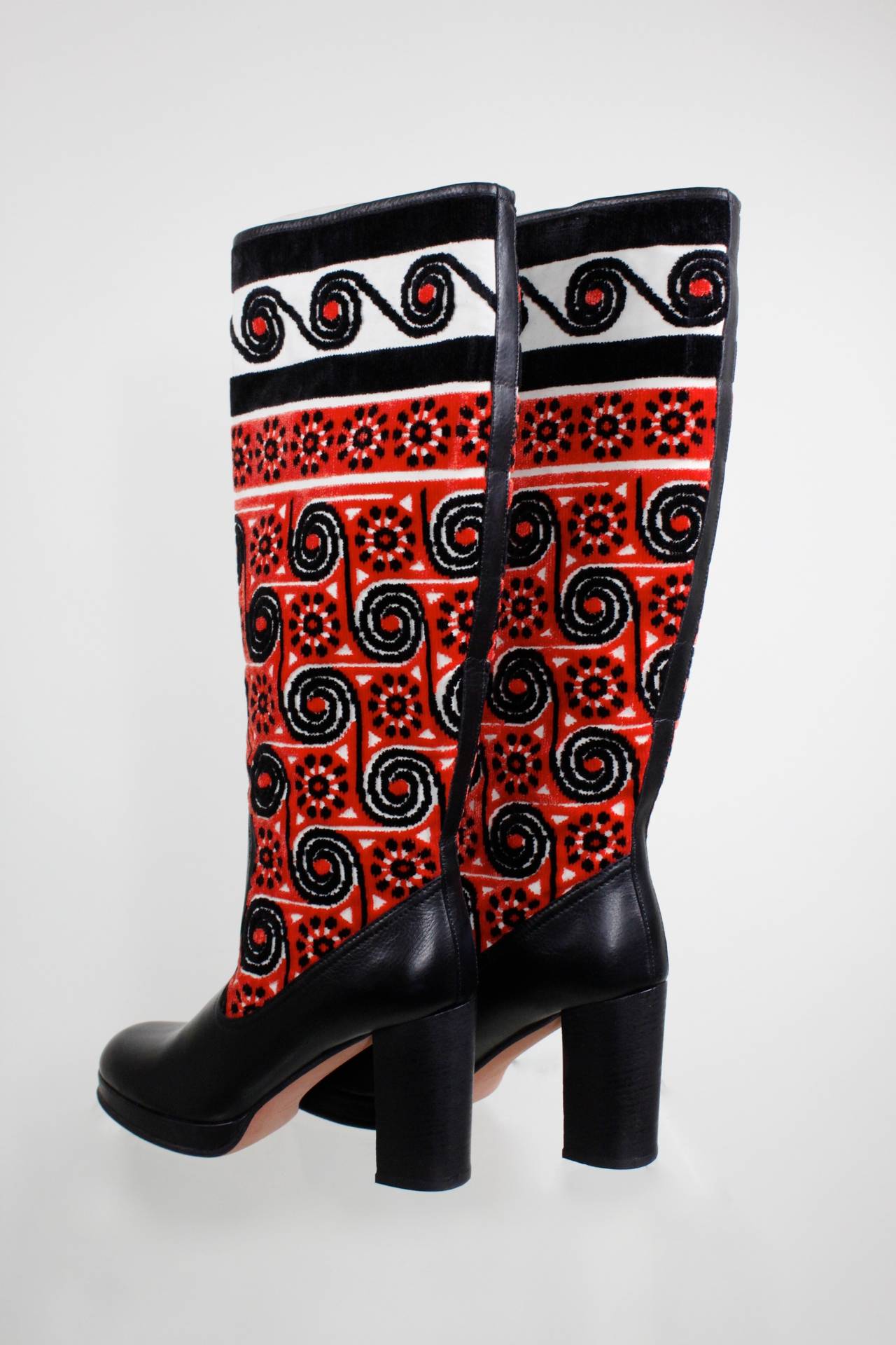 These fabulous black leather boots from Anna Sui feature a gorgeous, vibrant Eastern European chenille motif.

-Size 40
-3.75 inch heel
-No zip closure. Opening diameter is 15.5 inches. Ankle diameter is 12.5 inches.