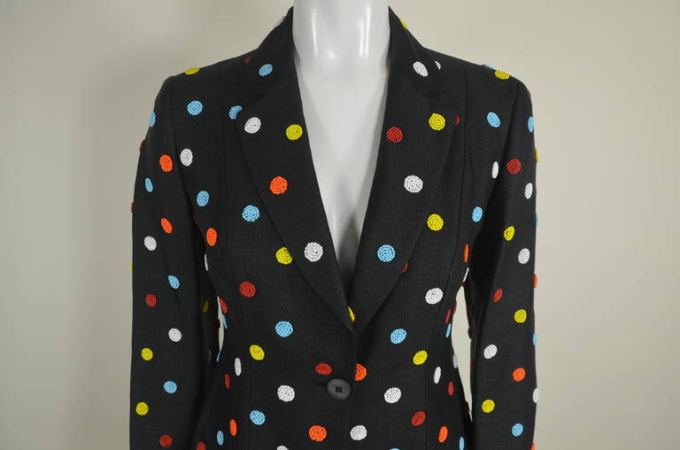 A woven rayon suit from Moschino Cheap & Chic features colorful beaded clusters, giving the effect of a sheet of candy dots. Woven rayon, giving an effect of a raffia weave. Candy-colored dot print. Fully lined.

Jacket
Bust: 34 - 36