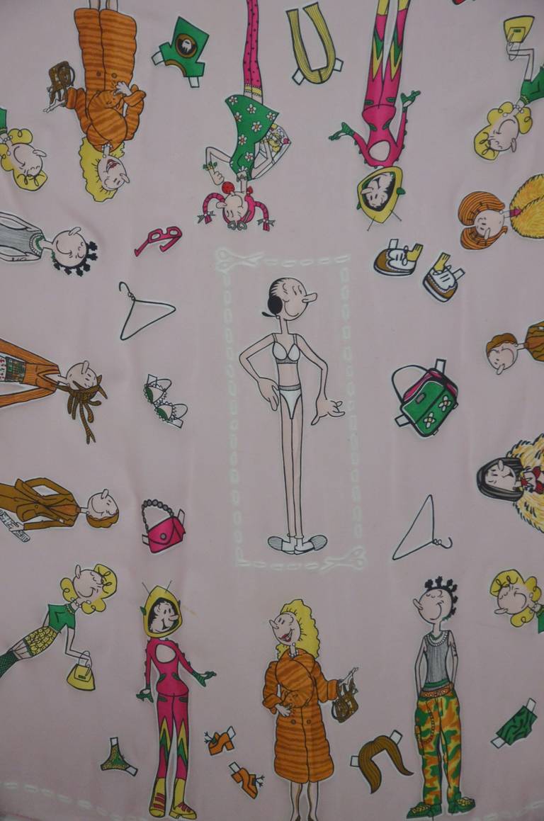 A pink sheer chiffon scarf from Moschino featuring Olive Oyl paperdoll characters throughout. Wearing various vibrant and whimsical outfits, Olive Oyl shows all the sides of her sassy personality!

Measurements: 33 1/2 inches x 34 1/2 inches
