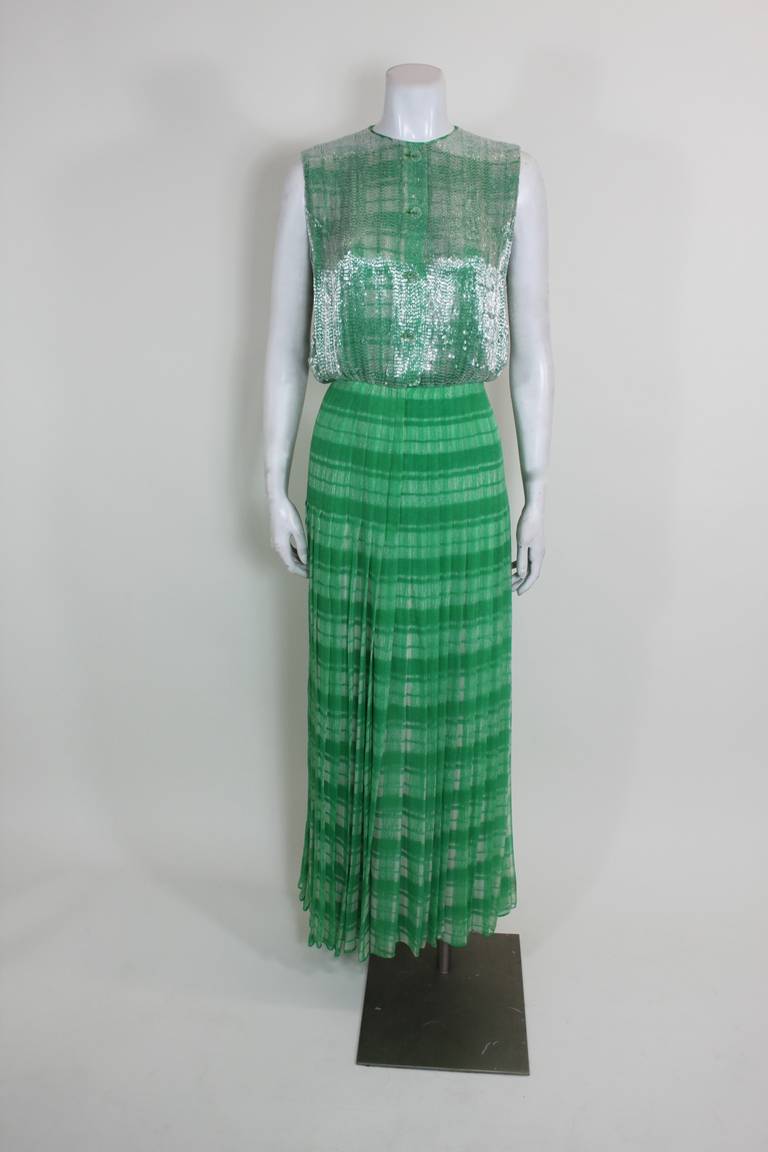 A beautiful evening gown from renowned American designer James Galanos. Aside from the beautiful tartan print and incredible beadwork, what makes this so gown is the attention to detail. From the inside seams to the hand-finished button holes, the