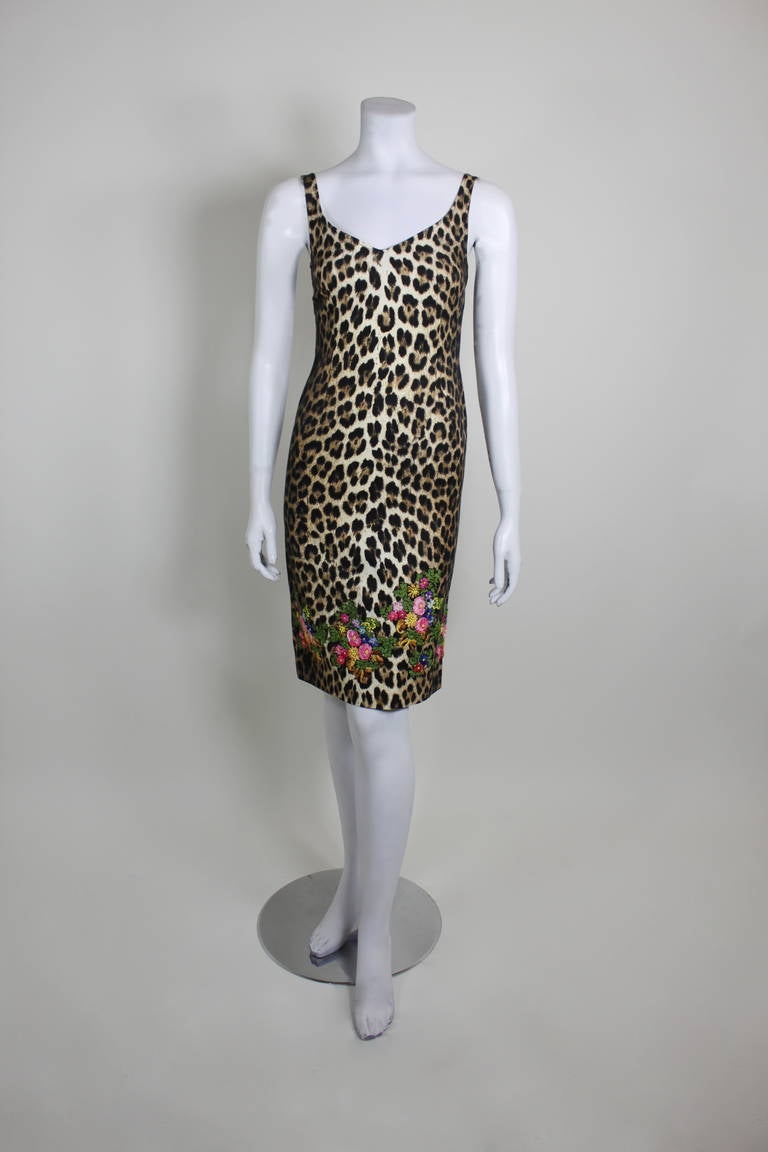 Exotic, feminine, and chic, this leopard print ensemble from Moschino is the perfect fall ensemble. Featuring a textured print and embellished with vibrant floral embroidery, the dress is ultra sexy and luxe. The jacket is beautifully