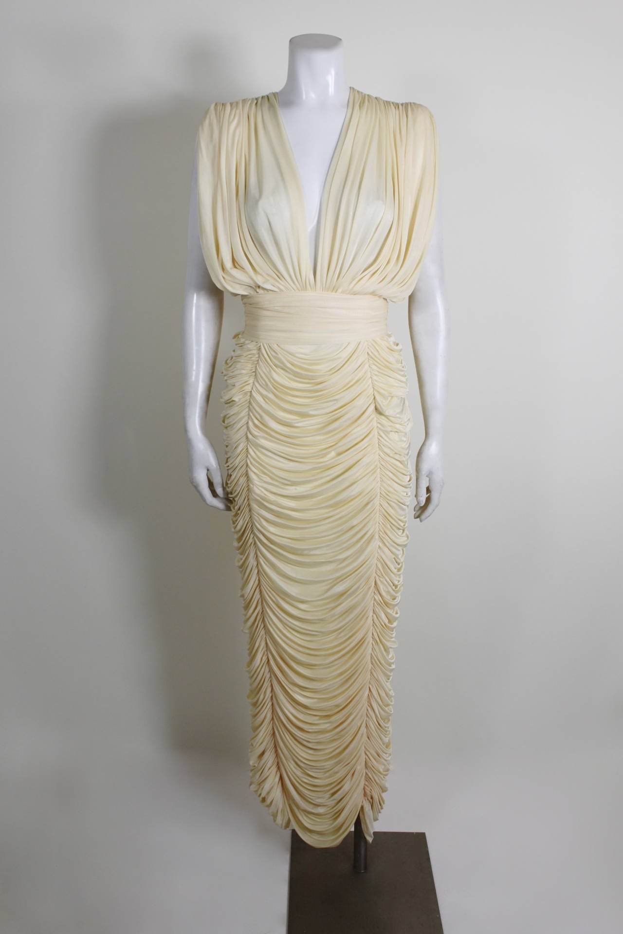 1980s Cream Tiered Confection Goddess Gown

Measurements--
*please note, the gown is quite stretchy. All measurements are done flat, but please inquire if you have additional questions regarding fit!
Bust: 36 inches
Waist: up to 32 inches
Hip: